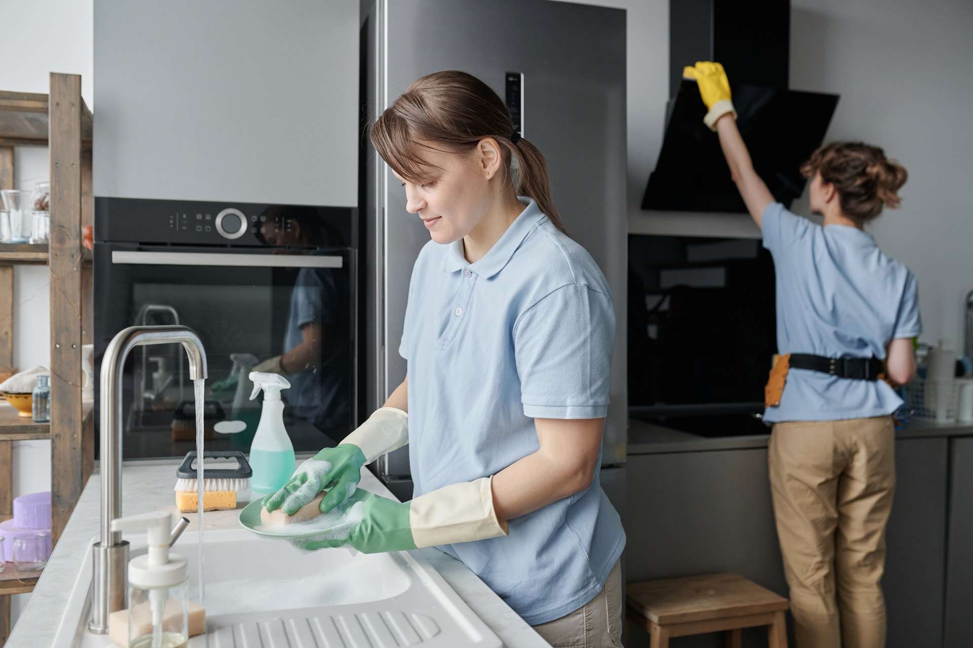 cleaner washing dishes in the kitchen during house 2023 11 27 05 23 42 utc