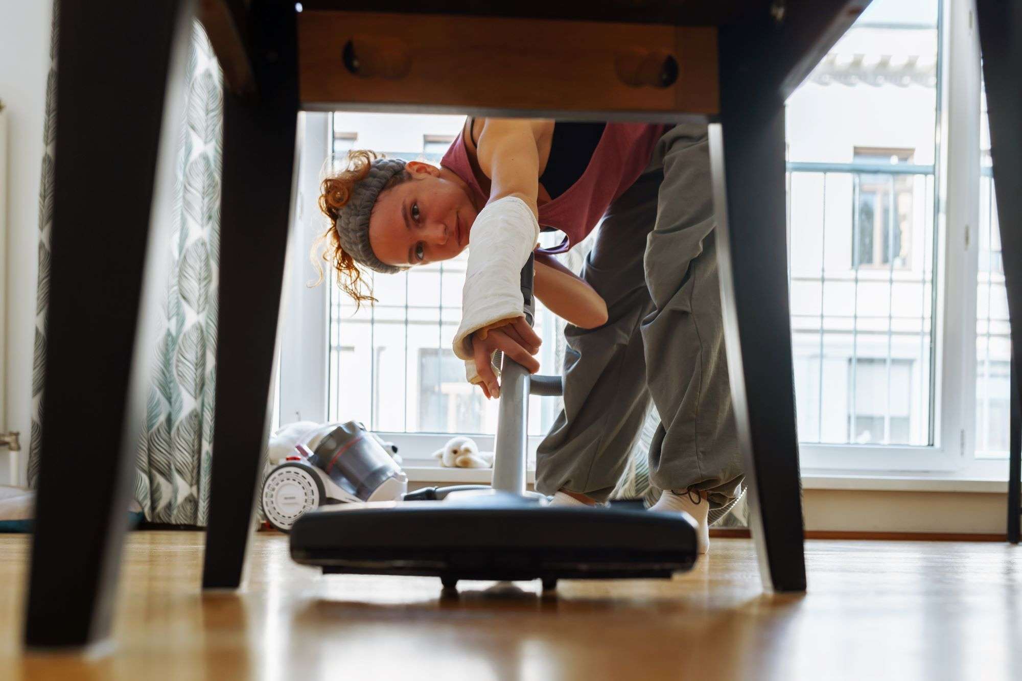 teen girl helps clean house vacuums floor 2023 11 27 05 06 49 utc